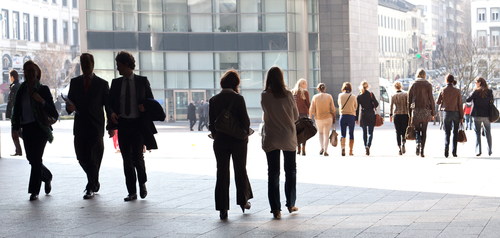 Outside an office building with people wearing suits